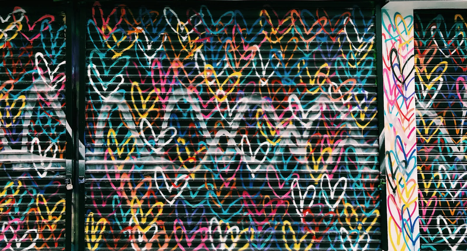 Shutter painted with colourful hearts