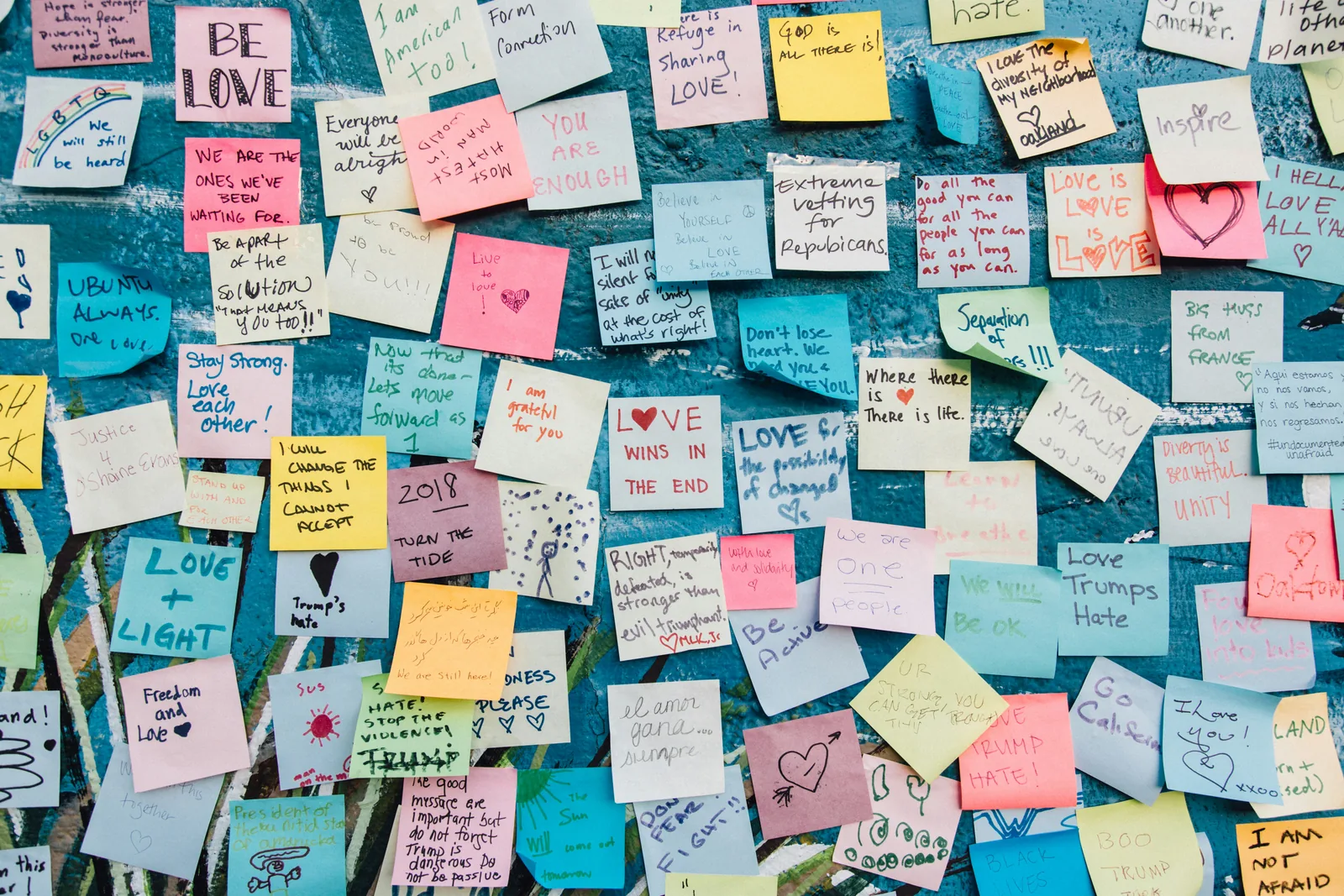 Wall of sticky notes with messages of love
